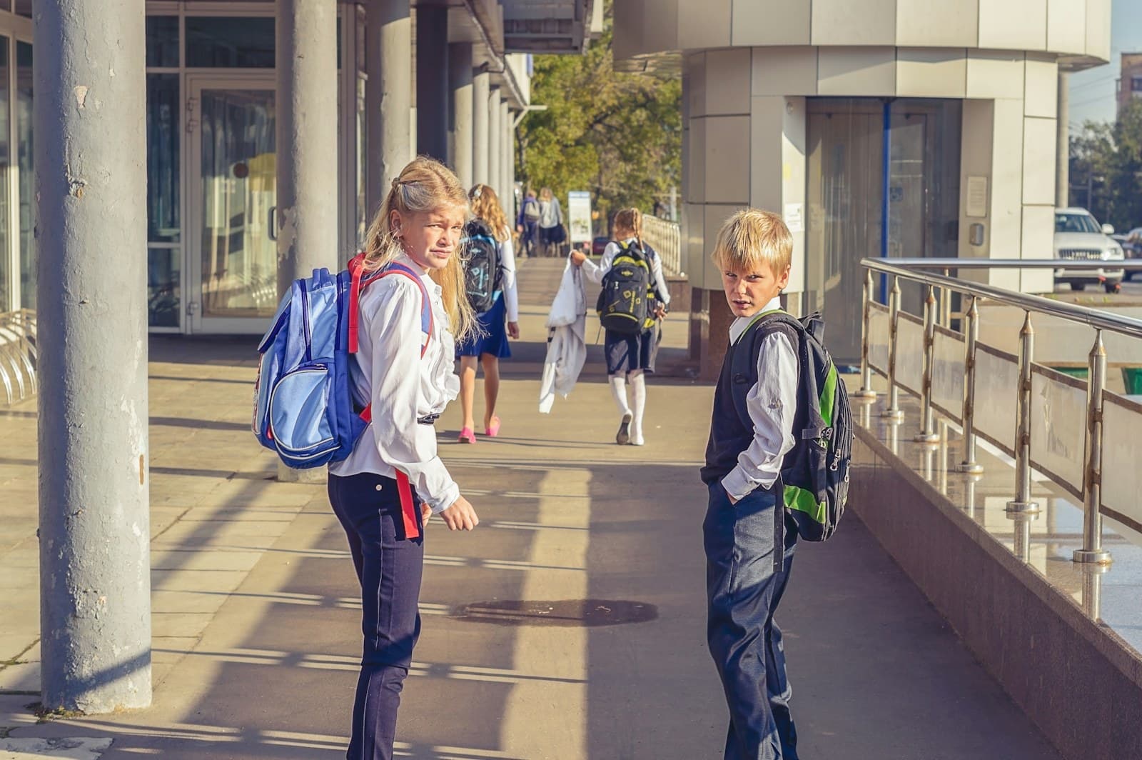 Students with backpacks walking to school